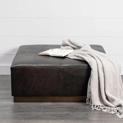 Relax in Style: Black Faux Leather and Brown Footstool Ottoman